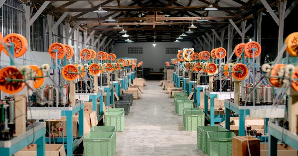 Spacious industrial hall with machinery and equipment for manufacturing. Ideal stock image for industry themes.