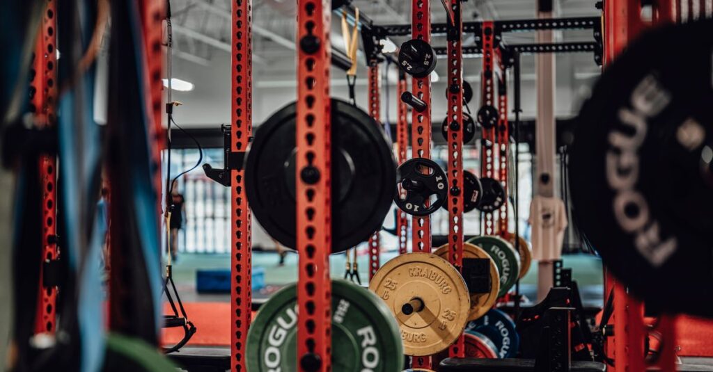 A well-equipped gym with various weightlifting gear and exercise equipment.
