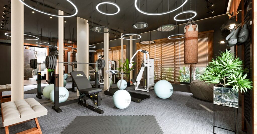 Stylish gym interior showcasing fitness equipment and contemporary lighting design.