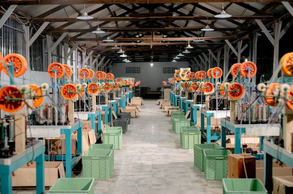 Spacious industrial hall with machinery and equipment for manufacturing. Ideal stock image for industry themes.