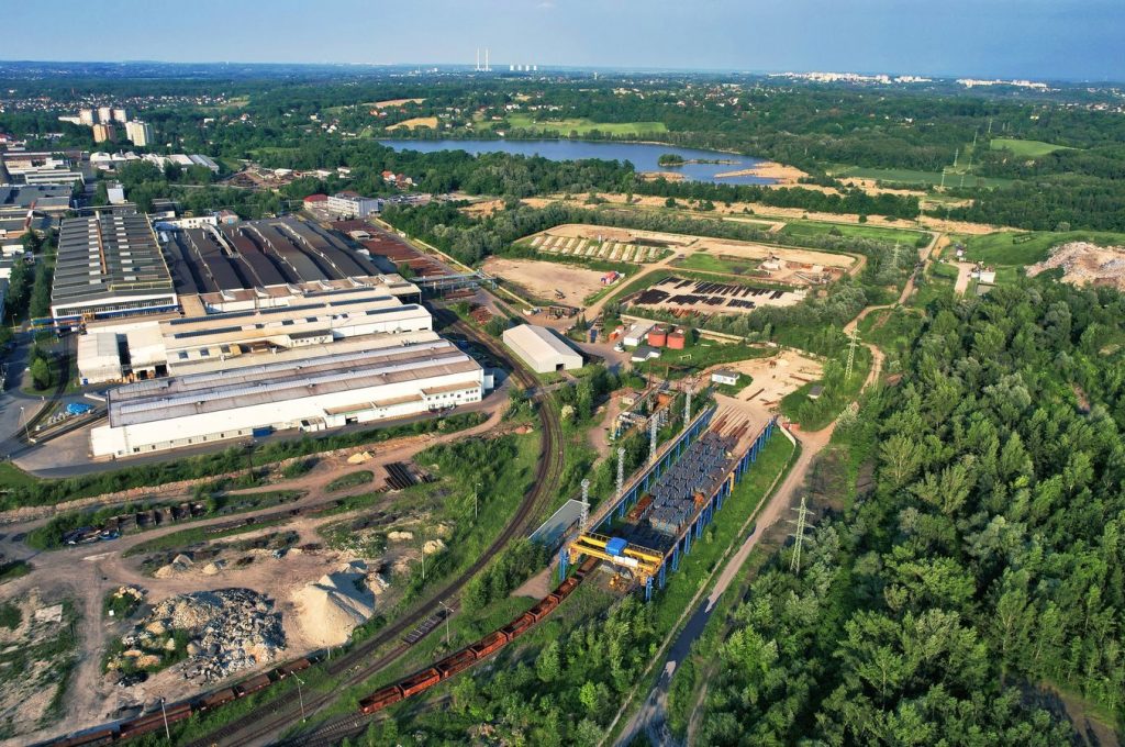 Aerial view of a large industrial complex surrounded by greenery in Bohumín, Czech Republic.