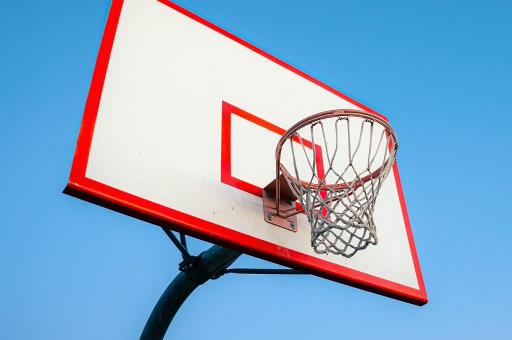 Outdoor basketball hoop and backboard under a clear blue sky in Lake Elsinore, CA.