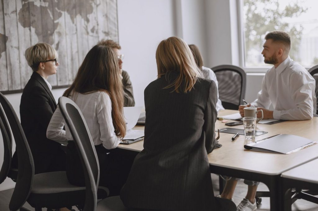 Colleagues in a productive meeting at a modern office, fostering teamwork and collaboration.