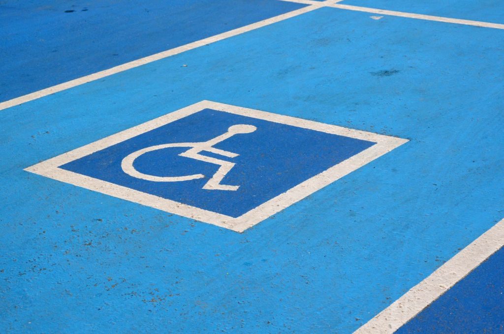Close-up of a blue disabled parking spot with a wheelchair symbol.